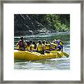 Lifestyle Shot Of A Group Of People As They Float Down The River In A Raft Framed Print
