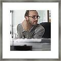 Man At Desk Listens Framed Print