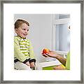 Man Giving Young Boy Apple Framed Print