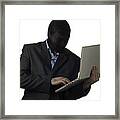 Man In A Mask Wearing Suit Holding Laptop Framed Print