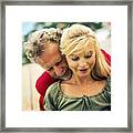 Man With Arms Wrapped Around Woman's Waist From Behind And Chin Resting On Her Shoulder Framed Print