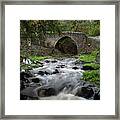 Medieval Stoned Bridge Water Flowing In The River. Framed Print