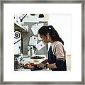 Mid Adult Korean Woman Chopping Vegetables On Kitchen Counter Framed Print