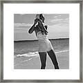 Model On A Beach Fastening Her Bathing Cap Framed Print