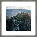 Morning Mist On The Bastei Rocks In Saxon Switzerland Framed Print