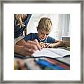 Mother Helping Son To Do His Homework Framed Print