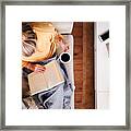 Overhead Shot Looking Down On Woman At Home Lying On Reading Book And Drinking Coffee Framed Print