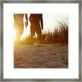People Walking In Sandy Dunes At Sunset Framed Print