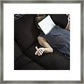 Playful Young Woman On Couch With Digital Tablet Framed Print