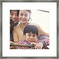 Portrait Of A Family Of Four On A Climbing Frame Framed Print
