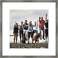 Portrait Of Adult Family With Dogs Jumping On Shingle Beach, Maine, Usa Framed Print