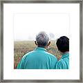 Portrait Of Asian Senior Couple On Bright Green Background Framed Print