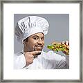 Portrait Of Chef Pointing At Sandwich Framed Print