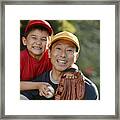 Portrait Of Father And Son With Baseball And Mitt Framed Print