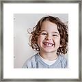 Portrait Of Smiling Boy With Curly Brown Hair Framed Print