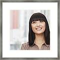 Portrait Of Smiling Young Woman Outdoors In Beijing, Looking Up Framed Print