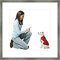Profile Of A Young Woman Giving Instructions To Her Dog Framed Print