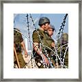 Razor Wire And Soldiers Framed Print