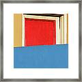 Red Door And Colored Walls Framed Print