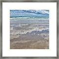 Reflecting On The Beach Framed Print