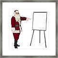 Santa Claus Pointing To An Isolated Whiteboard Framed Print
