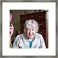 Senior Woman And Mature Man Laughing Framed Print