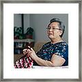 Senior Woman Knitting Framed Print