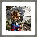 Side View Of Cheerful Young Woman Enjoying While Standing With Umbrella At Railroad Station During Monsoon Framed Print