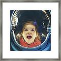 Small Girl Enjoying Being Inside Of Astronaut Suit Framed Print