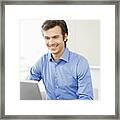 Smiling Businessman Working At Laptop Framed Print
