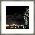 Statue On Charles Bridge And Illuminated Buildings In Prague In The Czech Republic Framed Print