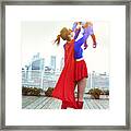 Superhero Mother Playing With Daughter On City Rooftop Framed Print