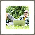 Teenage Boy Using Laptop Outdoors Framed Print