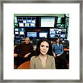 Three People Seated In Television Control Room Framed Print