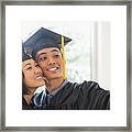 Usa, New Jersey, Jersey City, Portrait Of Young Woman And Young Man Wearing Graduation Gown Framed Print