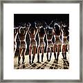 View From Behind Of Cheerleaders Cheering With Pompoms In Air Framed Print