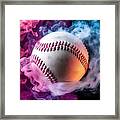 White Baseball Ball In Multi-colored Red Smoke From A Vape On A Black Isolated Background Framed Print