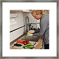 Woman Disinfecting Groceries During Covid-19 Framed Print