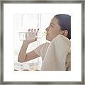 Woman Drinking Water In The Room Framed Print