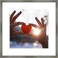 Woman Hands Holding Red Heart At Sunset Framed Print