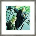 Woman Looking Into Camera, Businessman Looking At Woman. Framed Print