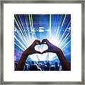 Woman Making Heart Shape With Hands At Music Event Framed Print