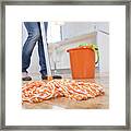 Woman Mopping Kitchen Floor, Low Section Framed Print