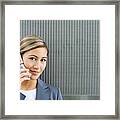 Woman Using Cell Phone, Smiling At Camera Framed Print