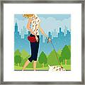 Woman Walking Dog In Park, Cityscape In Background, Side View Framed Print