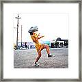 Woman Wearing A Dinosaur Mask Framed Print