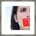 Woman With Red Tape Over Her Mouth Unable To Speak Framed Print