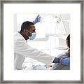 Young Black Stomatologist Talking To His Female Patient Framed Print