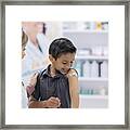 Young Boy Receives Bandage After Vaccine Framed Print