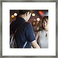 Young Couple At The Bus Stop Framed Print